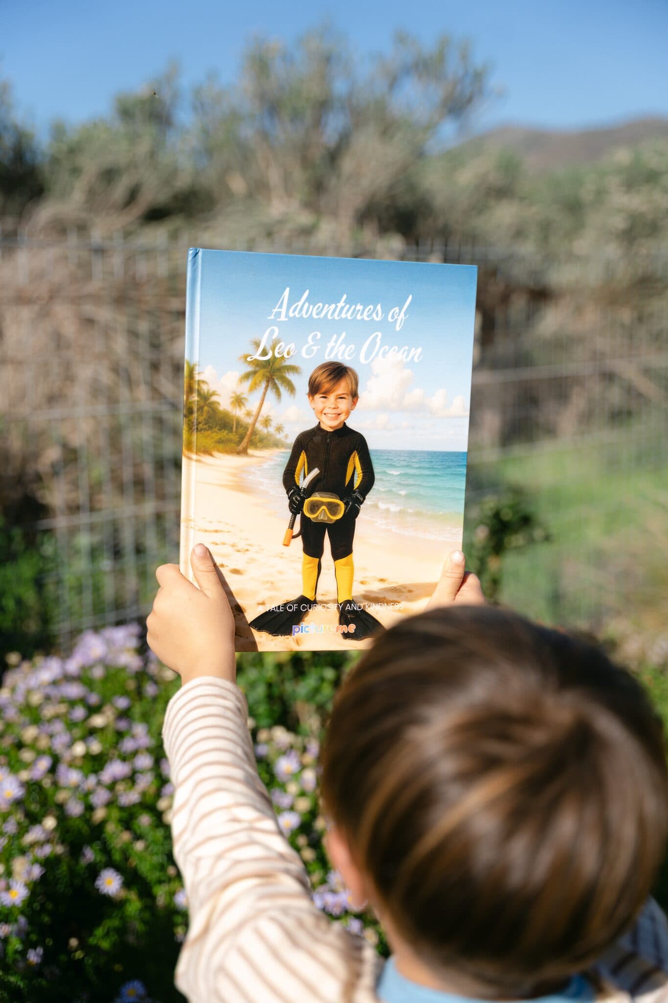 The ocean hardcover held up against a garden background