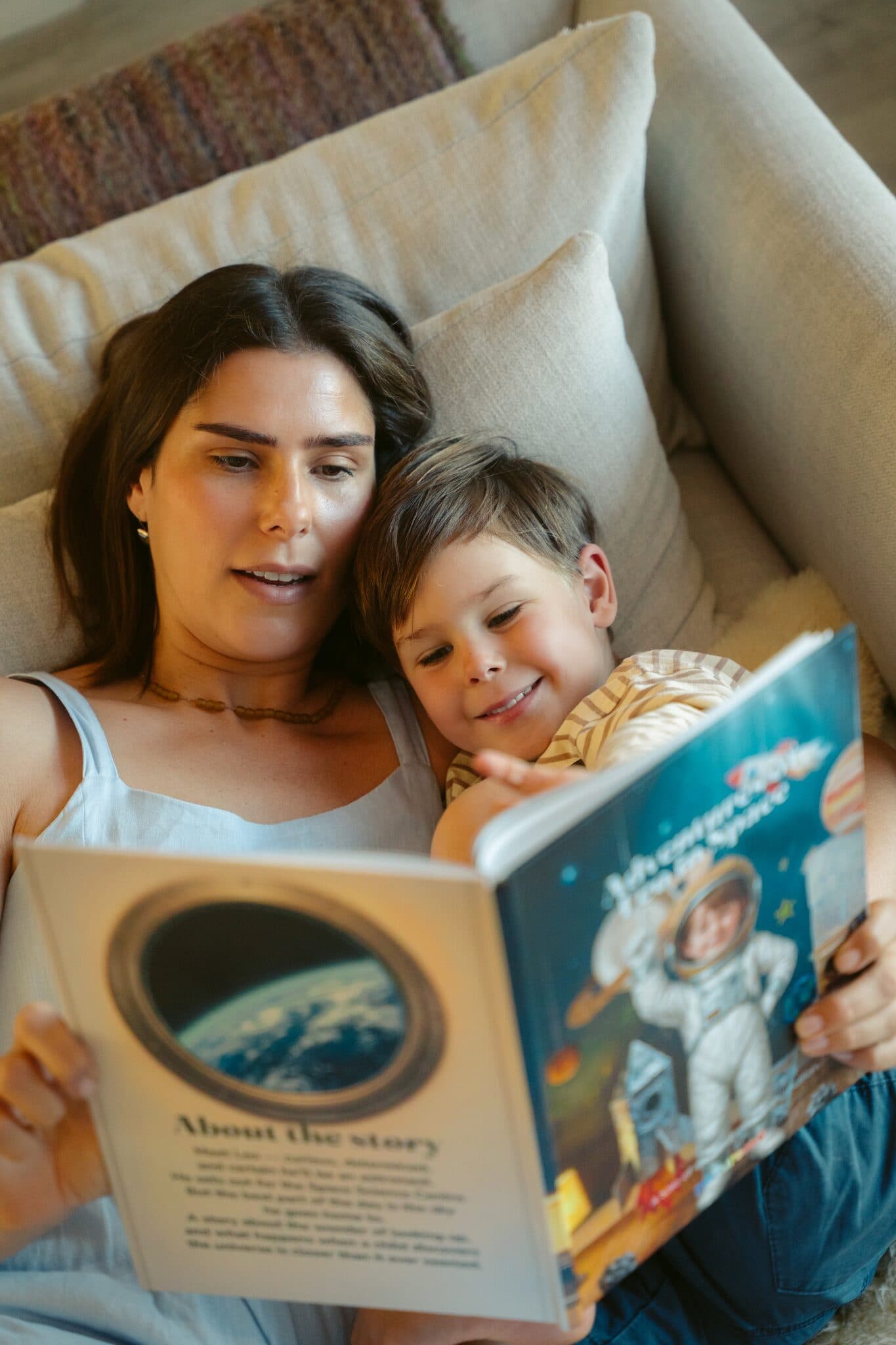 A mom and her son laughing over the space story together