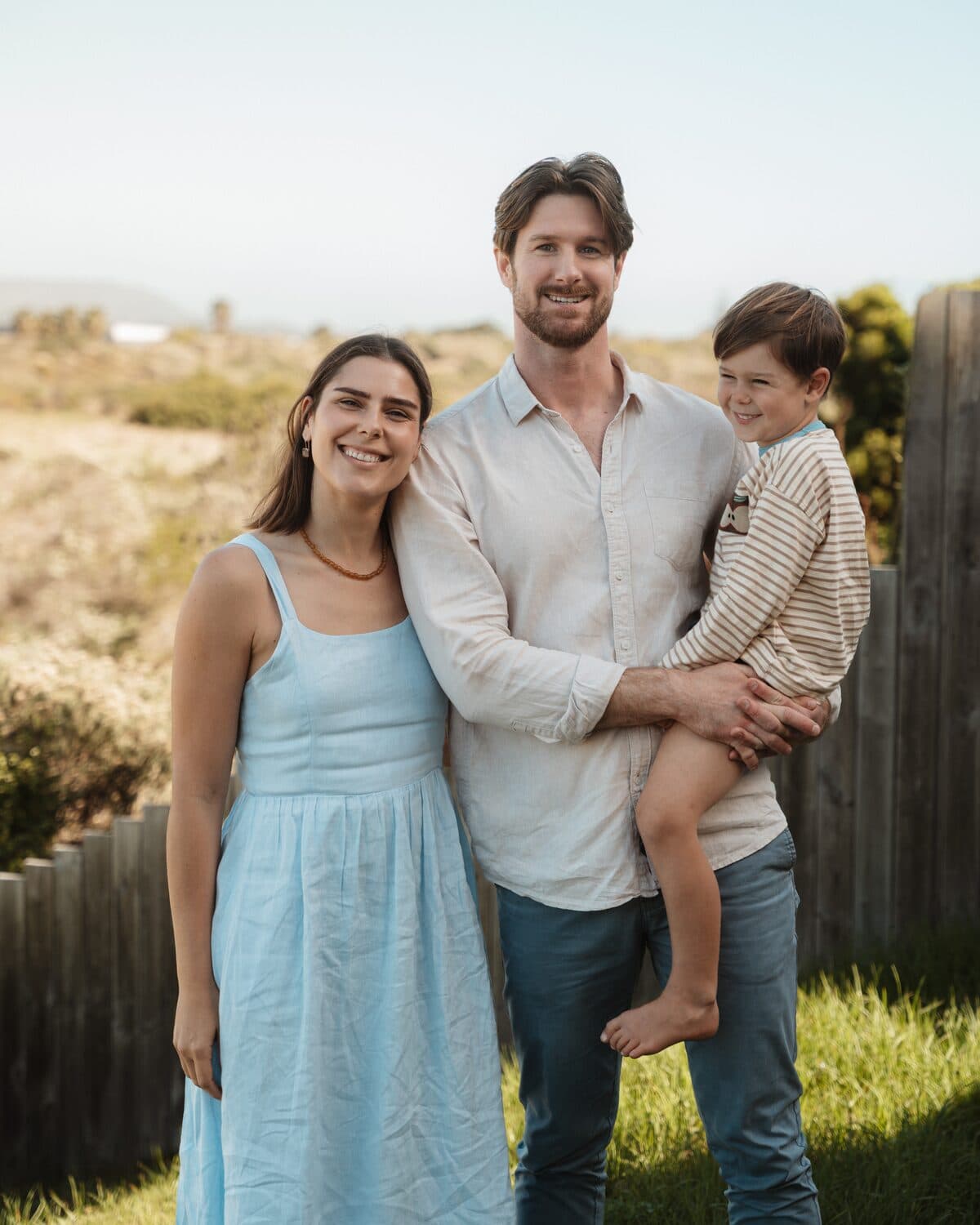 Nick and Michaella with their son, outdoors near home in Cape Town