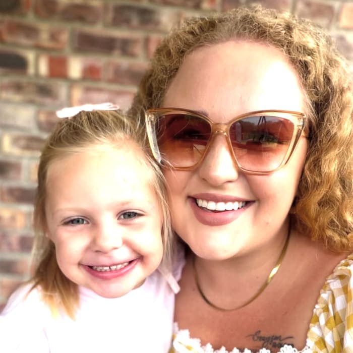 A mom and her daughter smiling together — a Picture Me family